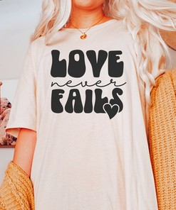 Inspirational Love Never Fails Christian T-Shirt with Faith Design