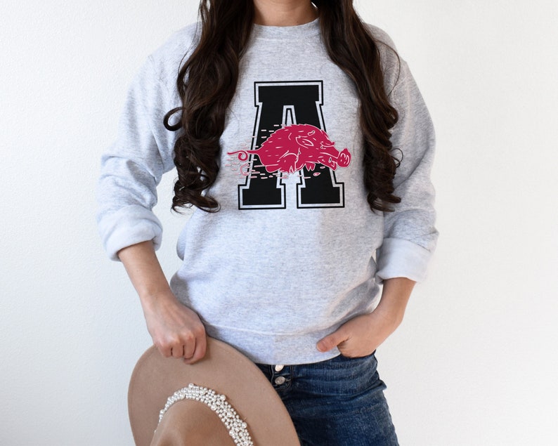 Score A Touchdown With Throwback Arkansas Razorback Apparel Sweatshirts, Crewnecks, Hoodies, And Shirts
