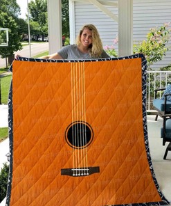 Add Some Retro Charm To Your Bed With This Acoustic Guitar Quilt Blanket