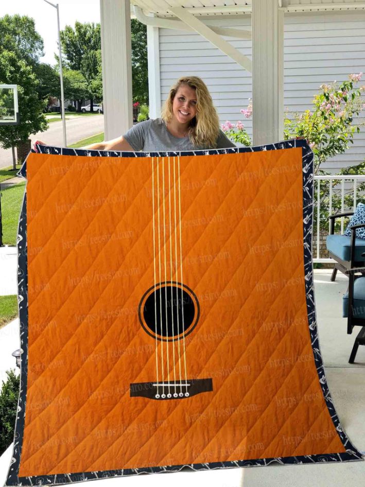 Add Some Retro Charm To Your Bed With This Acoustic Guitar Quilt Blanket