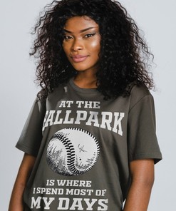 At the Ballpark is Where I Spend Most of My Days Unisex Tees with playful design and references to softball and baseball