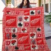 The Detroit Red Wings Wings Quilt Blanket - Support the Detroit Red Wings in style with this cozy quilt blanket.