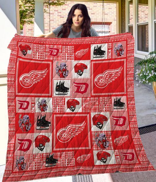 The Detroit Red Wings Wings Quilt Blanket - Support the Detroit Red Wings in style with this cozy quilt blanket.