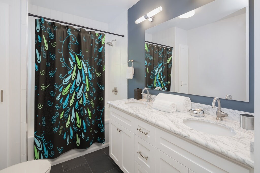 Peacock Feather Shower Curtain with Elegant Neon Blue and Green Design on a Black Background